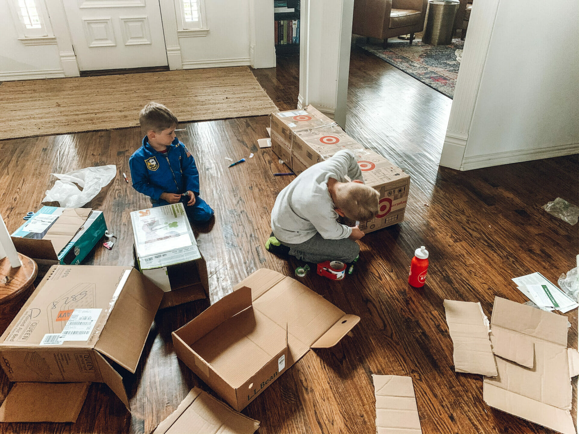 kids taping boxes together