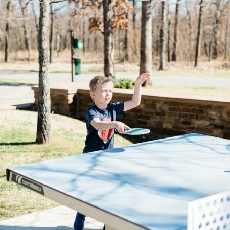 Child playing ping pong