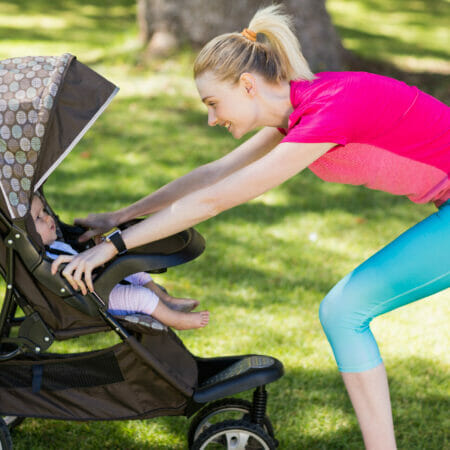 Woman walking with baby in stroller